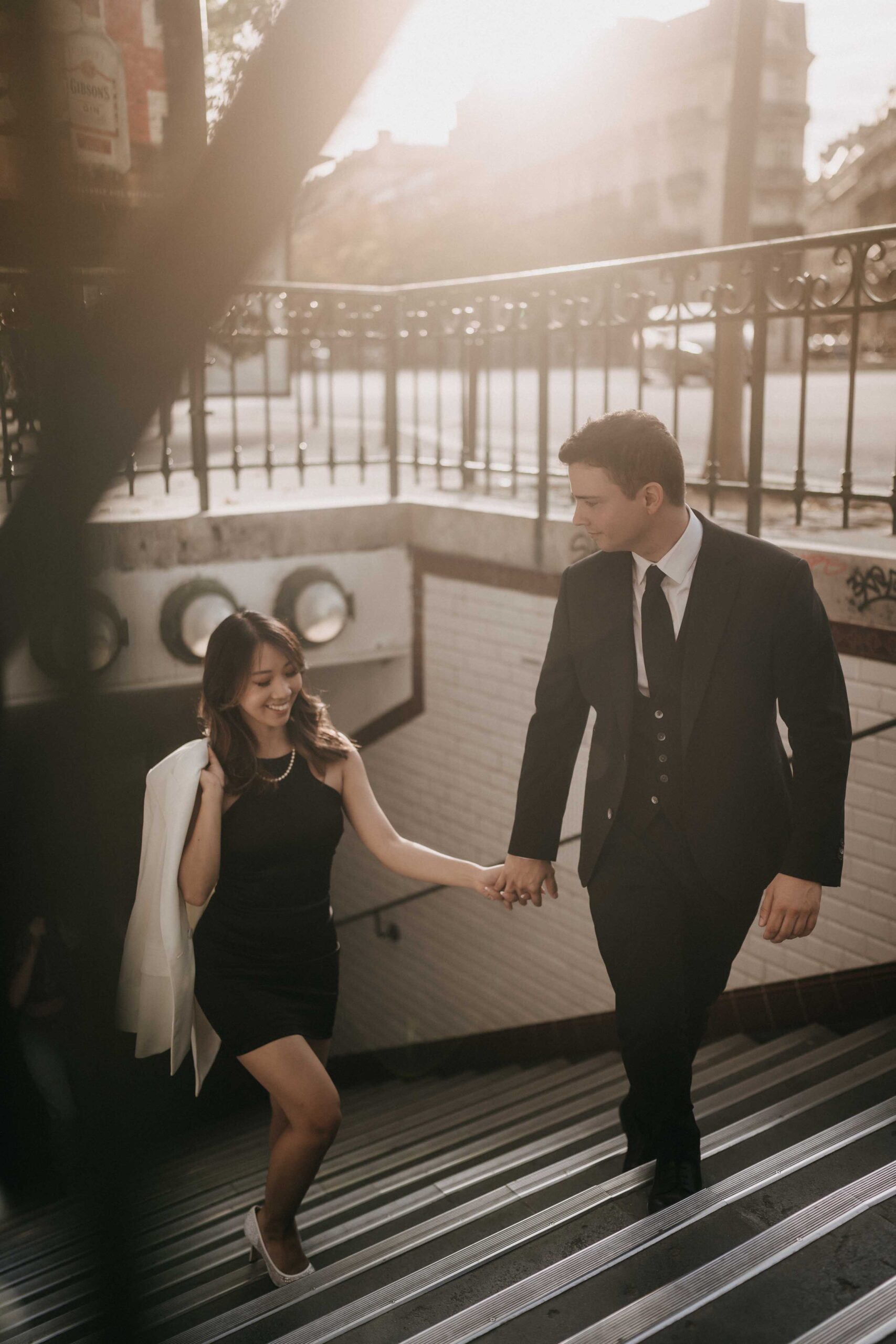 engagement photos in paris couple shot walking in the streets