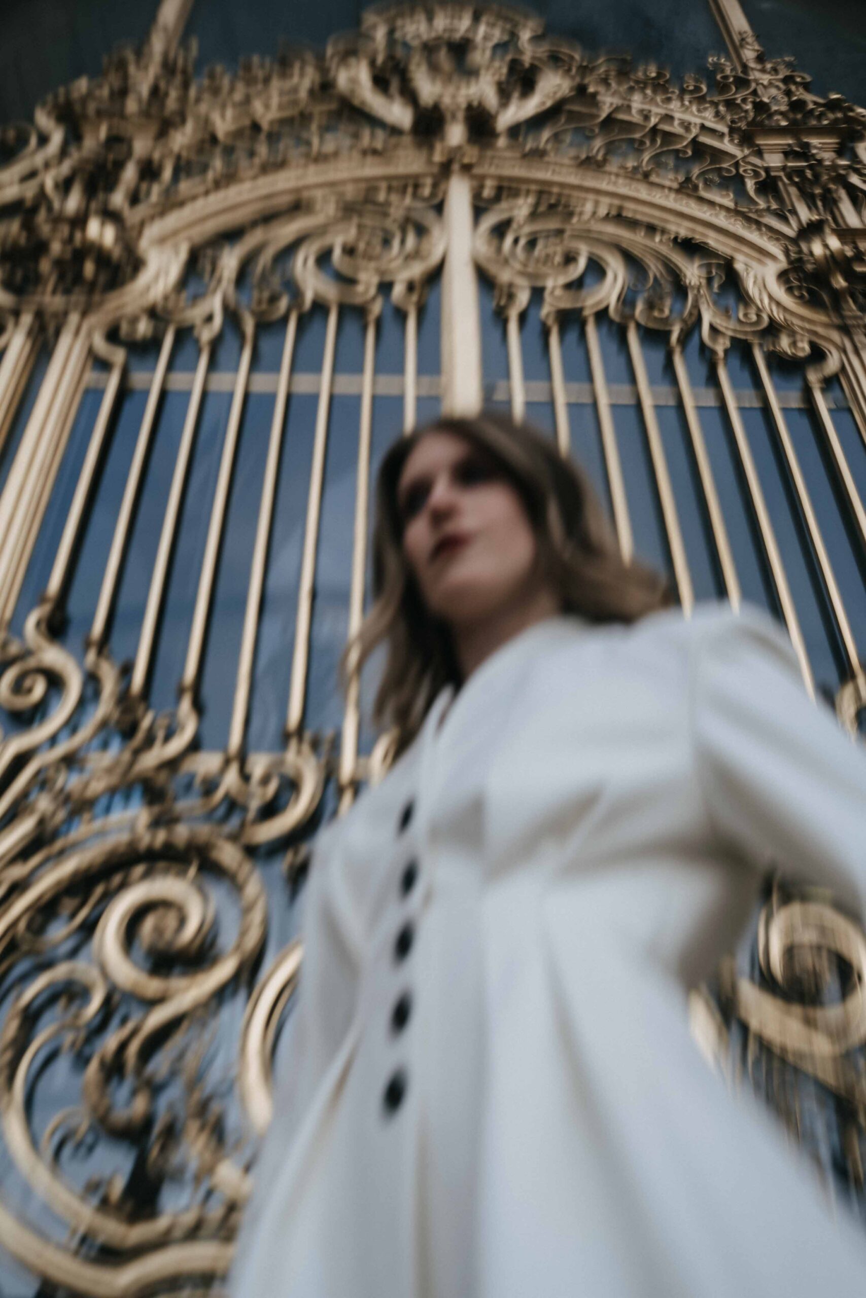 Gilded monumental gate in Paris during a wedding photography session.