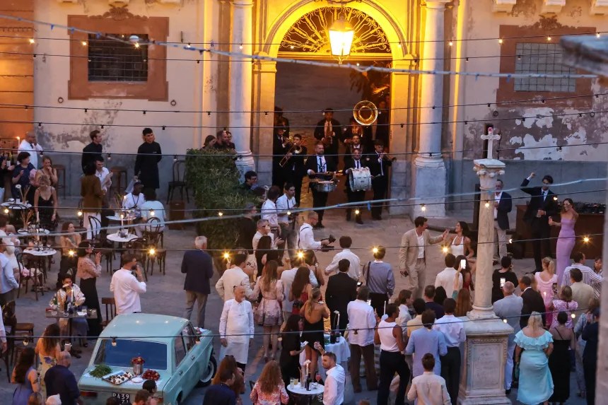wedding guests gathered in Piazza Croce dei Vespri in Palermo